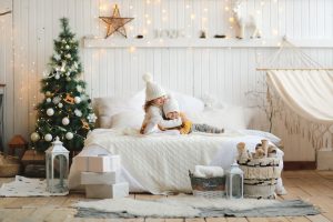 Cozy,Little,Sisters,Are,Hugging,On,The,Bed,In,White